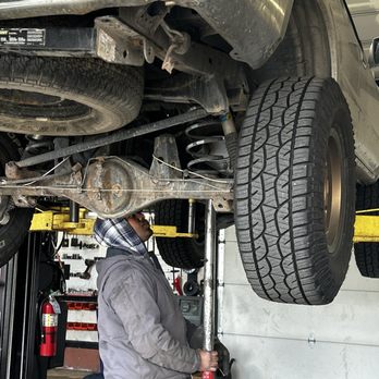 Damaged muffler inspected for expert muffler repair in Denver, CO